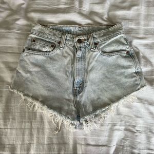 Light wash denim Levi’s 521 cutoff shorts